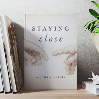 Staying Close by John A. Martin displayed on a shelf