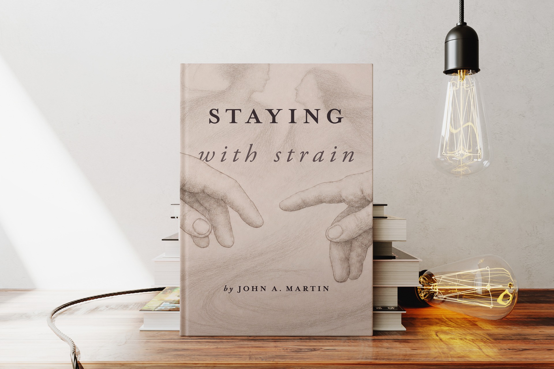 Staying with Strain by John A. Martin displayed with books and lamps